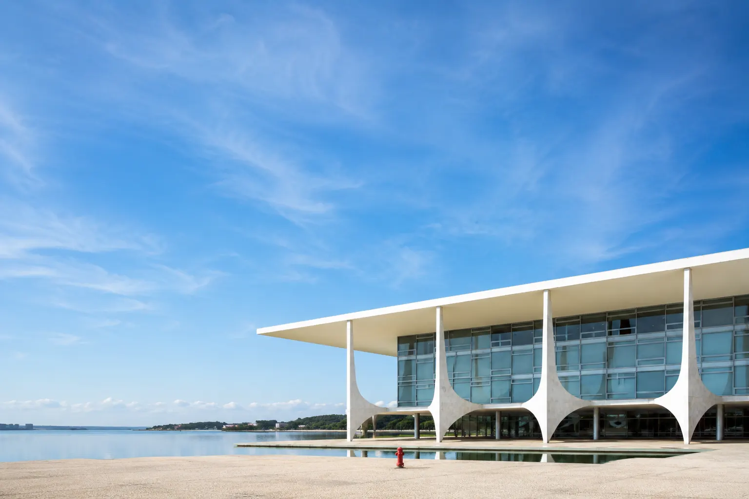 Bayline's modernist waterfront event pavilion under a wide blue sky